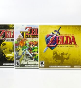 three nintendo games are shown on a white surface